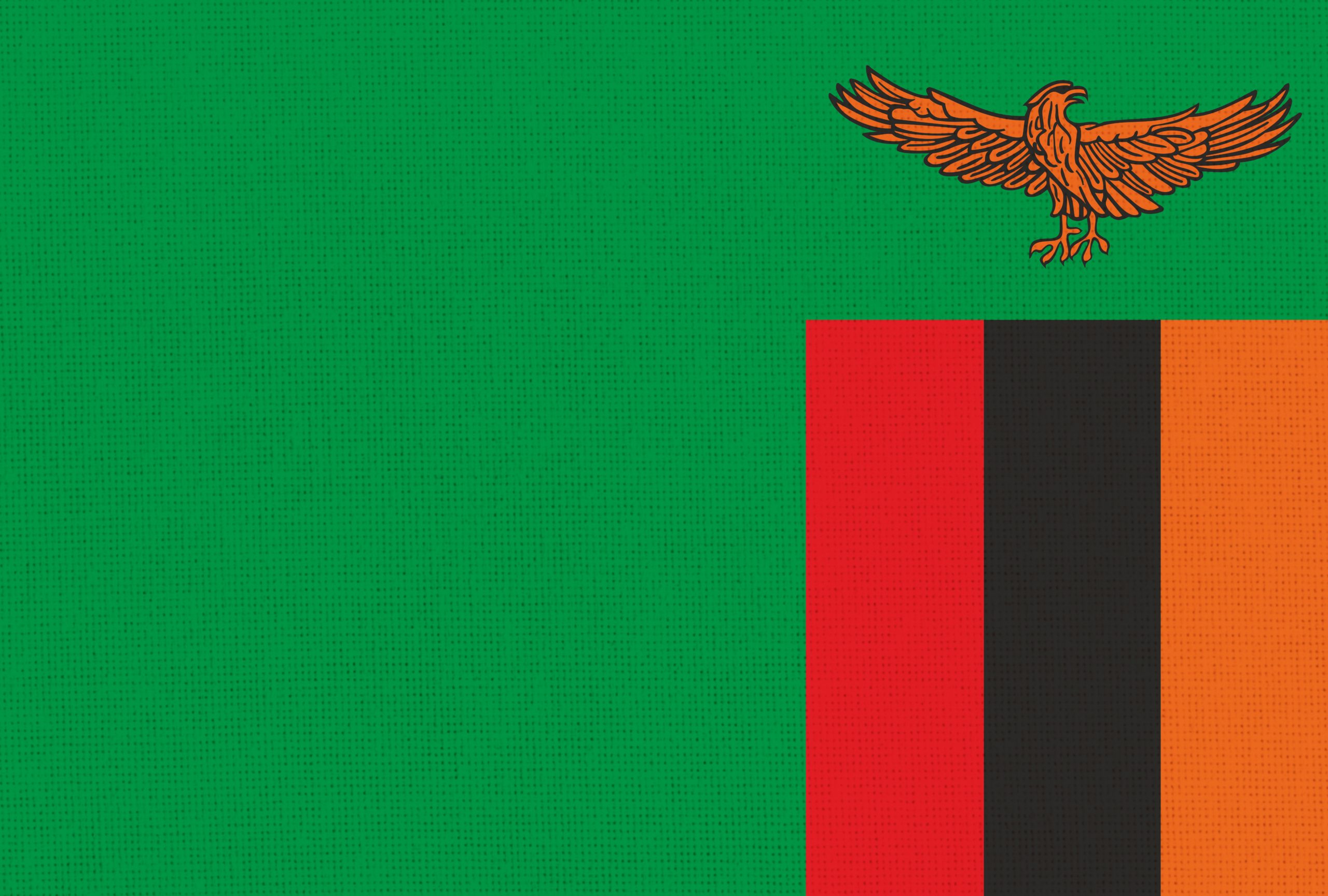 flag of Zambia. National Zambian flag on fabric surface. Zambia national flag on textured background. Fabric Texture. Republic of Zambia. African country. state symbol